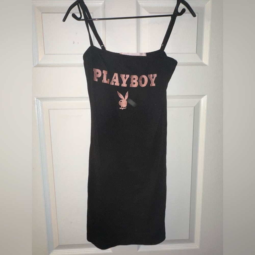 NWOT never worn playboy black dress. Pink embroidering, body con fit.